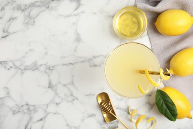 Delicious bee's knees cocktail and ingredients on white marble table, flat lay. Space for text