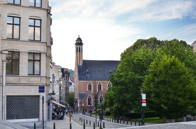 City street with beautiful buildings and green trees