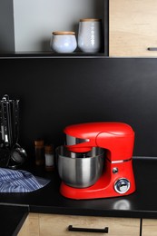 Photo of Modern stand mixer on countertop in kitchen. Home appliance