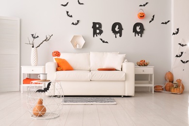 Stylish room interior with creative Halloween decor