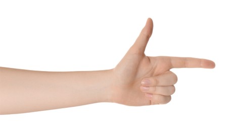 Woman pointing at something with index finger isolated on white, closeup