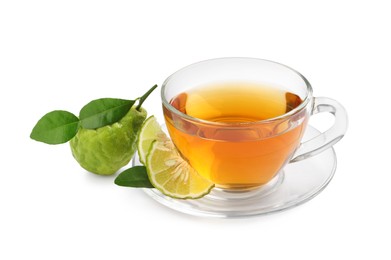 Glass cup of tasty bergamot tea and fresh fruits on white background