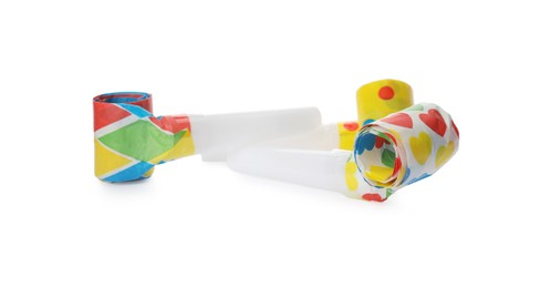 Bright party blowers on white background. Festive items