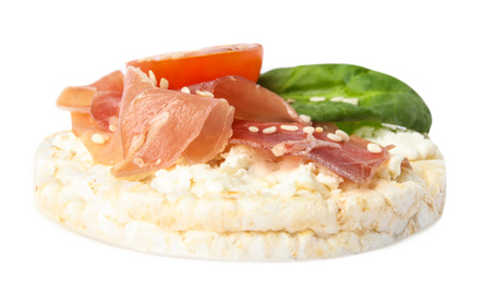 Puffed rice cake with prosciutto, tomato and basil isolated on white