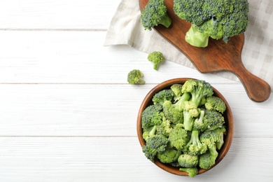 Flat lay composition with fresh green broccoli on wooden background