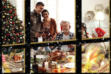 Happy family enjoying festive dinner indoors, view through window. Christmas celebration