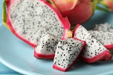 Photo of Plate with delicious cut white pitahaya fruit, closeup