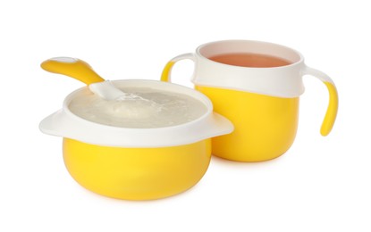 Healthy baby food in bowl and drink on white background
