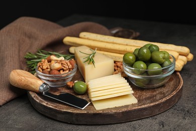 Snack set with delicious Parmesan cheese on grey table