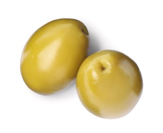 Two fresh green olives on white background, top view