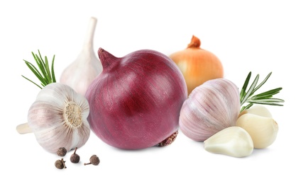 Mix of fresh garlic and onions on white background