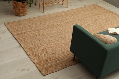 Beige carpet on wooden floor in living room