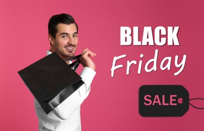 Black Friday Sale. Young handsome man with shopping bag on pink background 