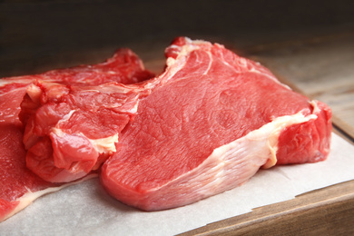 Fresh raw beef cut on table, closeup