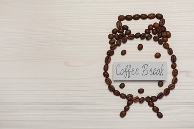 Alarm clock made of beans and card with phrase Coffee Break on white wooden table, flat lay. Space for text