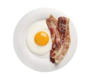 Photo of Tasty fried egg with bacon in plate isolated on white, top view