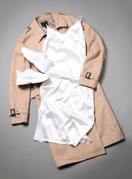 Stylish white dress and coat on grey background, flat lay