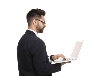 Young businessman with laptop on white background