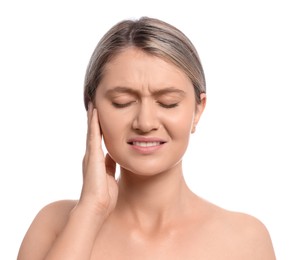 Young woman suffering from ear pain on white background