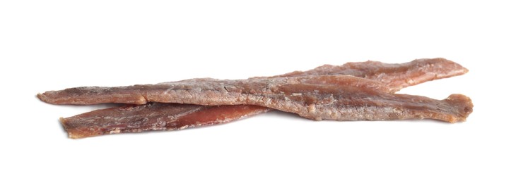 Photo of Delicious salted anchovy fillets on white background