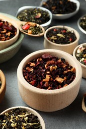 Many different herbal teas on grey table