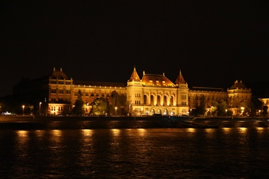 BUDAPEST, HUNGARY - APRIL 27, 2019: Beautiful night cityscape with illuminated University of Technology and Economics