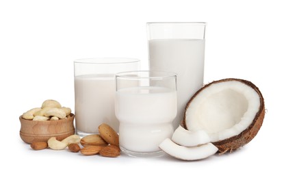Vegan milk and different nuts on white background