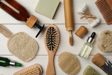 Flat lay composition with eco friendly products on white wooden background. Conscious consumption