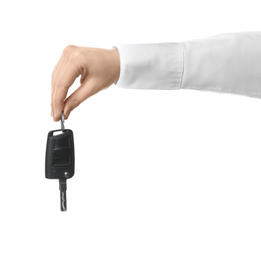 Photo of Man holding key on white background, closeup. Car buying