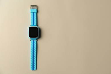 Kid smart watch on grey background, top view. Space for text