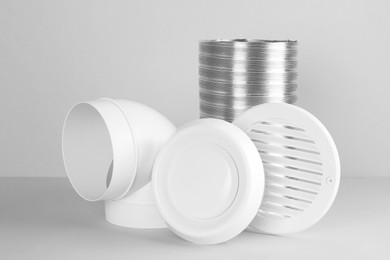 Parts of home ventilation system on light grey background