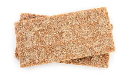 Fresh crunchy rye crispbreads on white background, top view