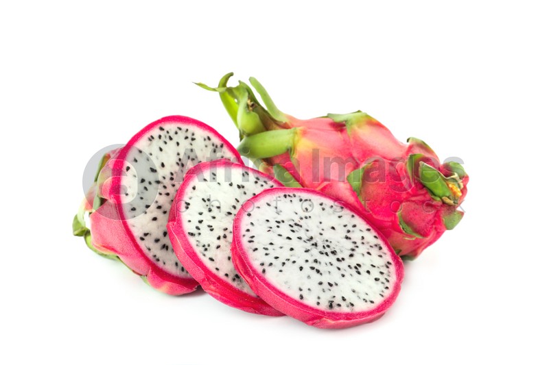 Photo of Delicious cut and whole pitahaya fruits on white background