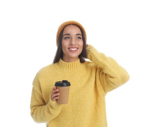 Happy beautiful woman with paper cup of mulled wine on white background