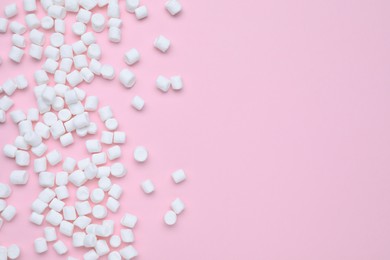 Photo of Delicious sweet marshmallows on pink background, flat lay. Space for text