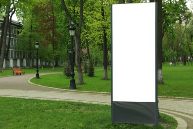 Blank advertising board in park. Space for design