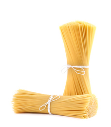 Tied uncooked Italian spaghetti isolated on white