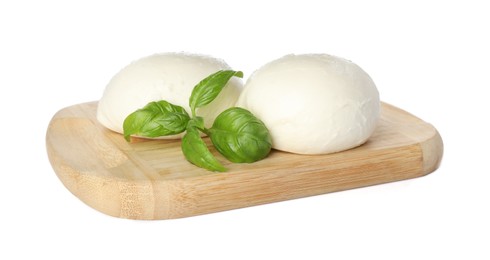 Wooden board with delicious mozzarella cheese balls and basil on white background