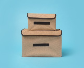 Two textile storage cases on light blue background