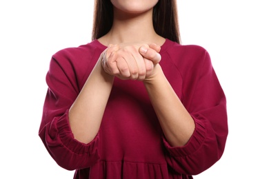 Photo of Woman showing BELIEVE gesture in sign language on white background, closeup