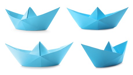 Set with light  blue paper boats on white background