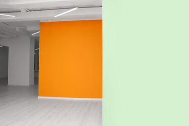 Empty office room with white and orange walls. Interior design