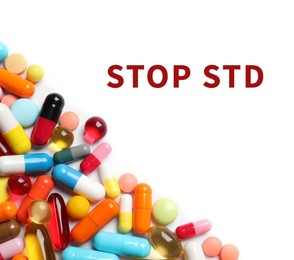 Different pills and text STOP STD on white background, top view