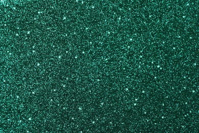 Shiny dark green glitter as background, closeup