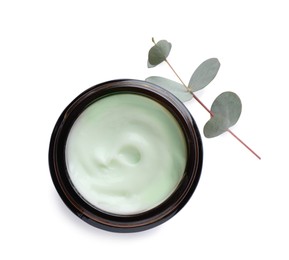 Jar of hand cream and eucalyptus on white background, top view