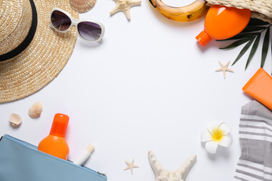 Composition with sun protection products and beach accessories on white background, top view. Space for text