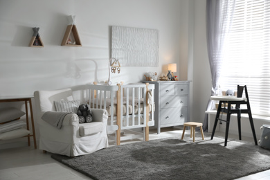 Baby room interior with crib and highchair. Idea for design
