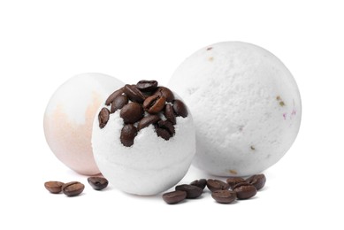 Fragrant bath bombs and coffee beans on white background