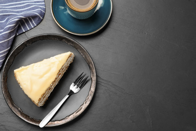 Delicious cake with condensed milk on black table, flat lay. Space for text
