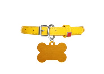 Photo of Yellow leather dog collar with bone shaped tag isolated on white